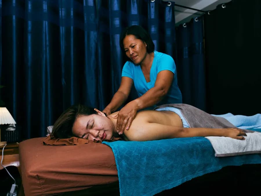 A guest receiving a massage in the spa area