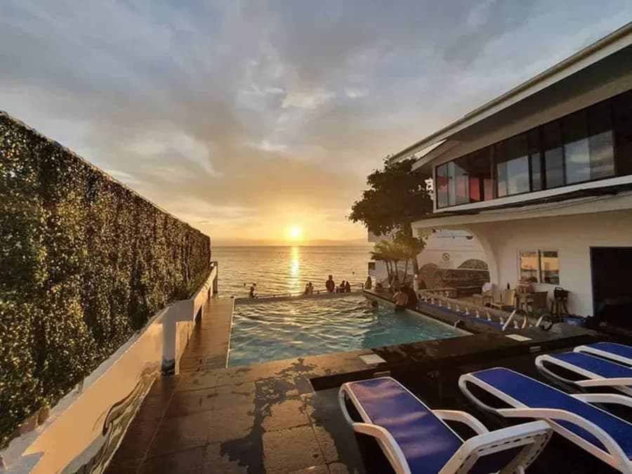 The infinity pool at sunset, looking straight out over the sea